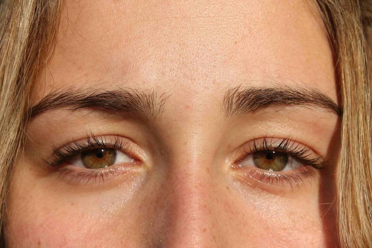 Close-up of defined eyebrows held in place by long-lasting eyebrow setting product
