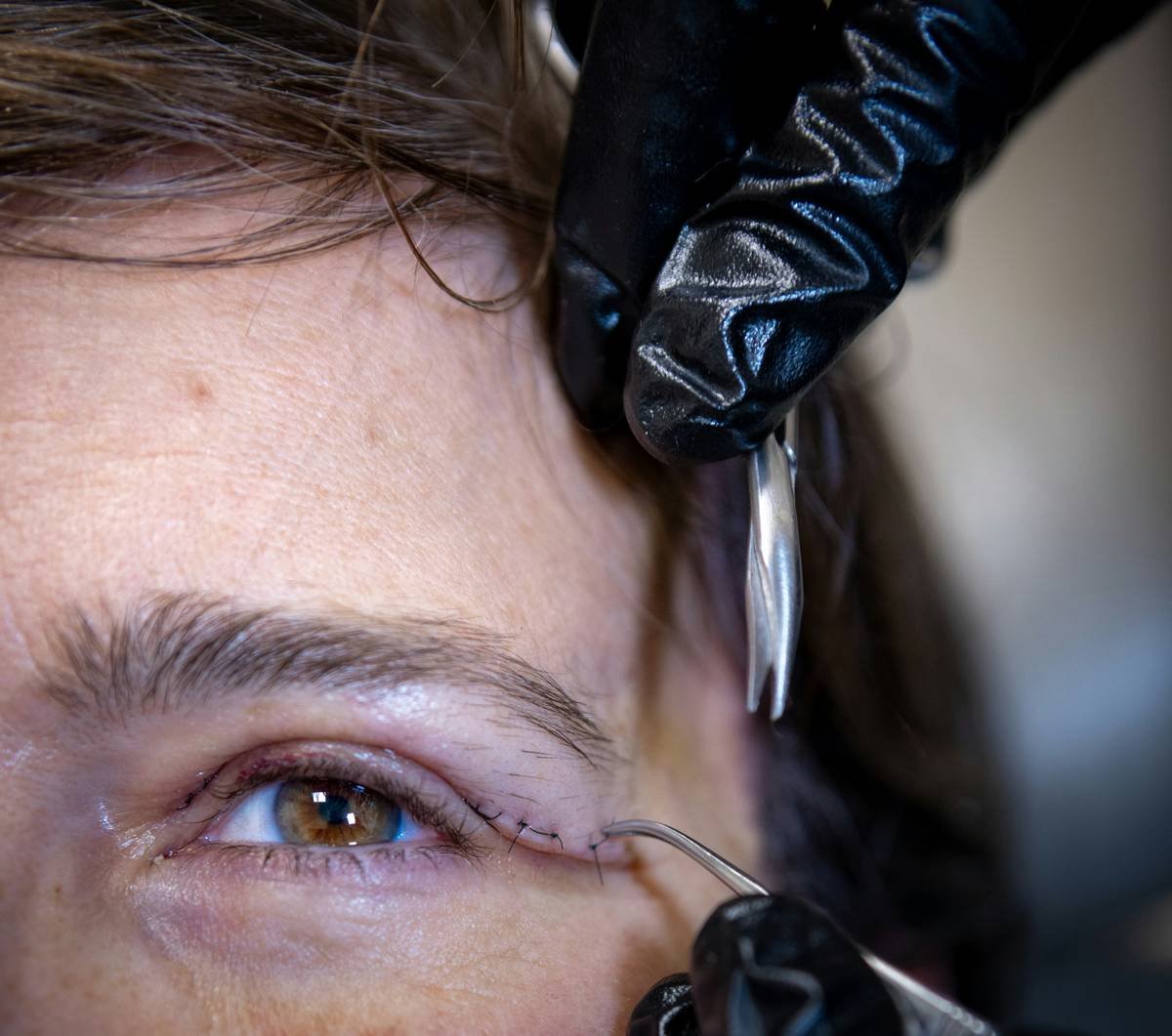 precision brow styling gel application technique showing angled brush strokes for natural lift